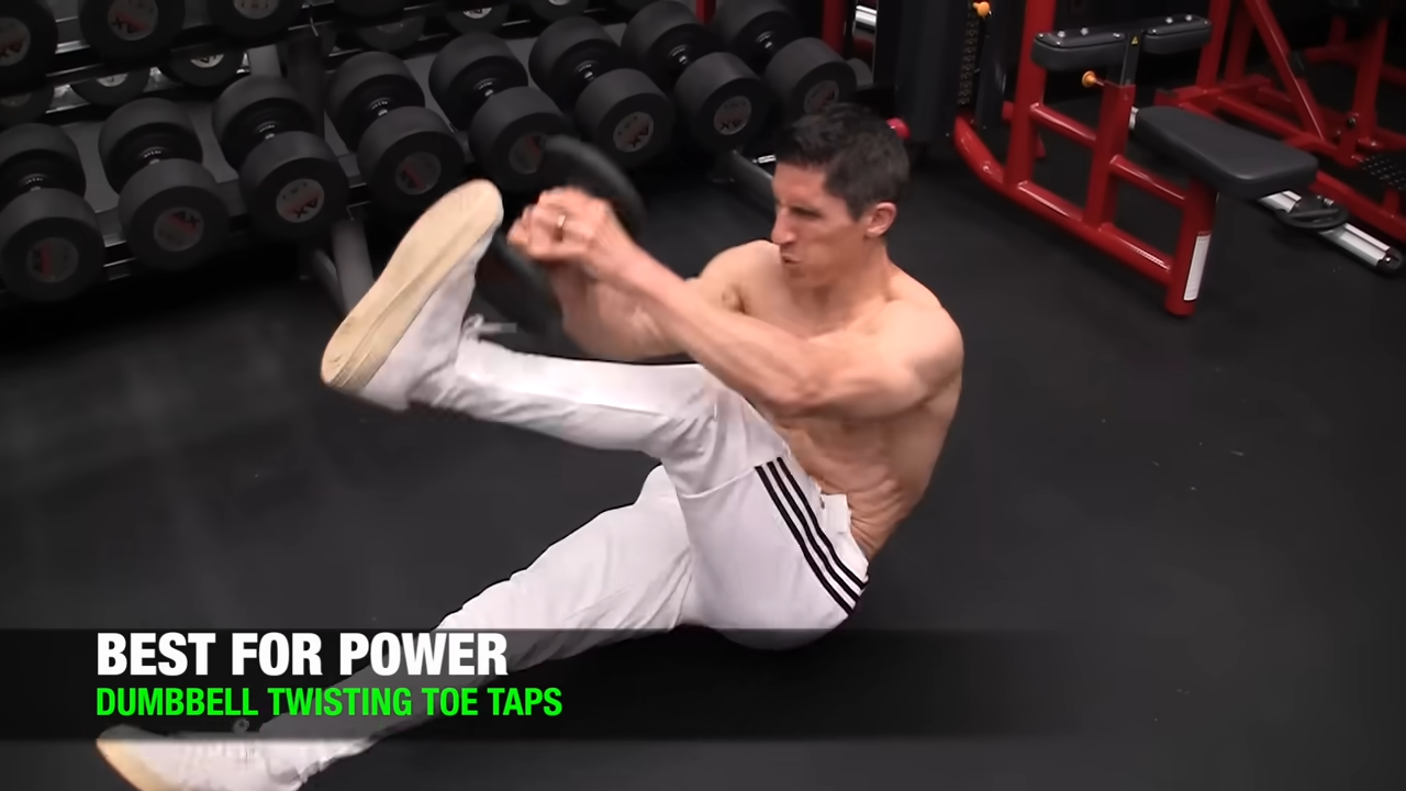 dumbbell twisting toe taps